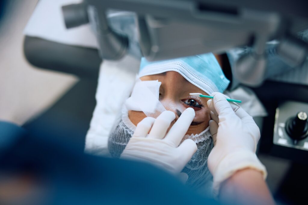Close up of woman during eye laser surgery at ophthalmology clinic.